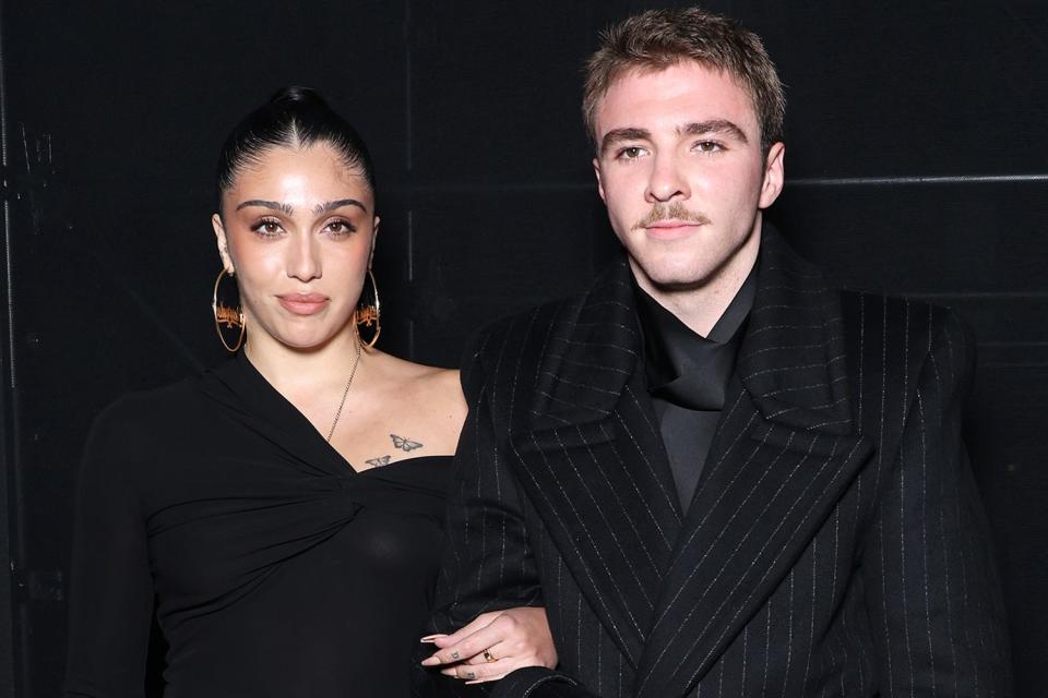 <p>Pascal Le Segretain/Getty</p> Lourdes Leon and brother Rocco Ritchie attend the Saint Laurent show at Paris Fashion Week on Sept. 26.