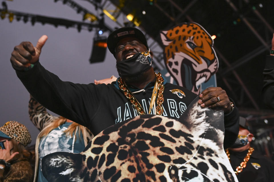 A Jacksonville Jaguars fan celebrates after the Jacksonville Jaguars chose Clemson quarterback Trevor Lawrence with the first pick in the NFL football draft Thursday, April 29, 2021, in Cleveland. (AP Photo/David Dermer)