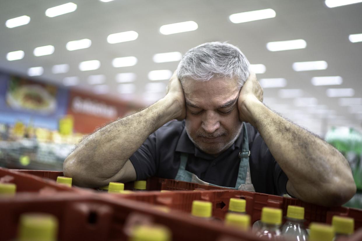 Employee or owner feeling bad at working on supermarket