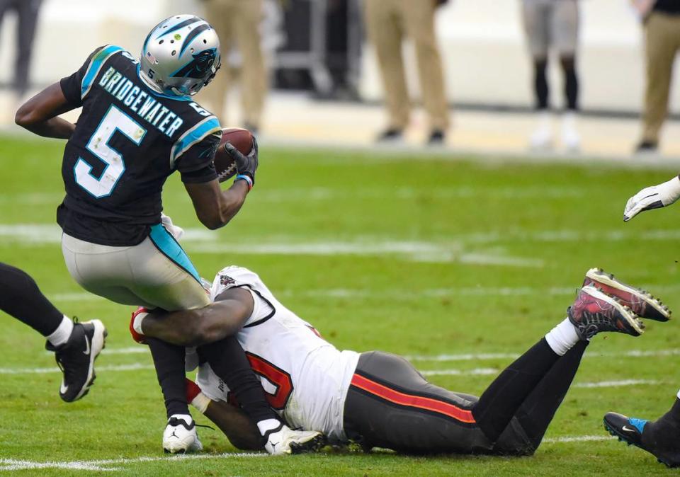 Carolina Panthers quarterback Teddy Bridgewater, left, is sacked by Tampa Bay Buccaneers outside linebacker Jason Pierre-Paul in November.