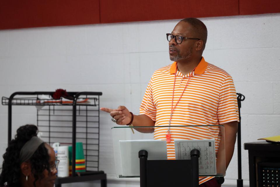 Patriot Prep athletics director Curt Caffey speaks to students and parents about the charter school's plans to start a football program. The Eagles will begin by forming a middle school team, but the goal is to eventually have a high school varsity squad.