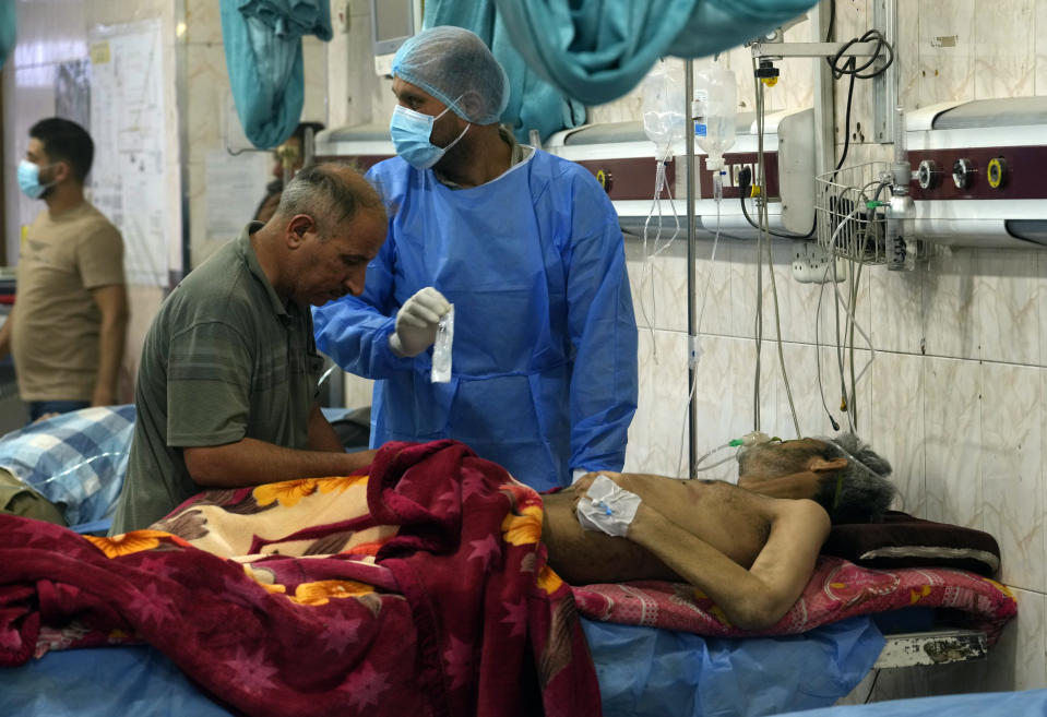 People with breathing problems are treated at a hospital during a sandstorm in Baghdad, Iraq, Monday, May 16, 2022. (AP Photo/Hadi Mizban)