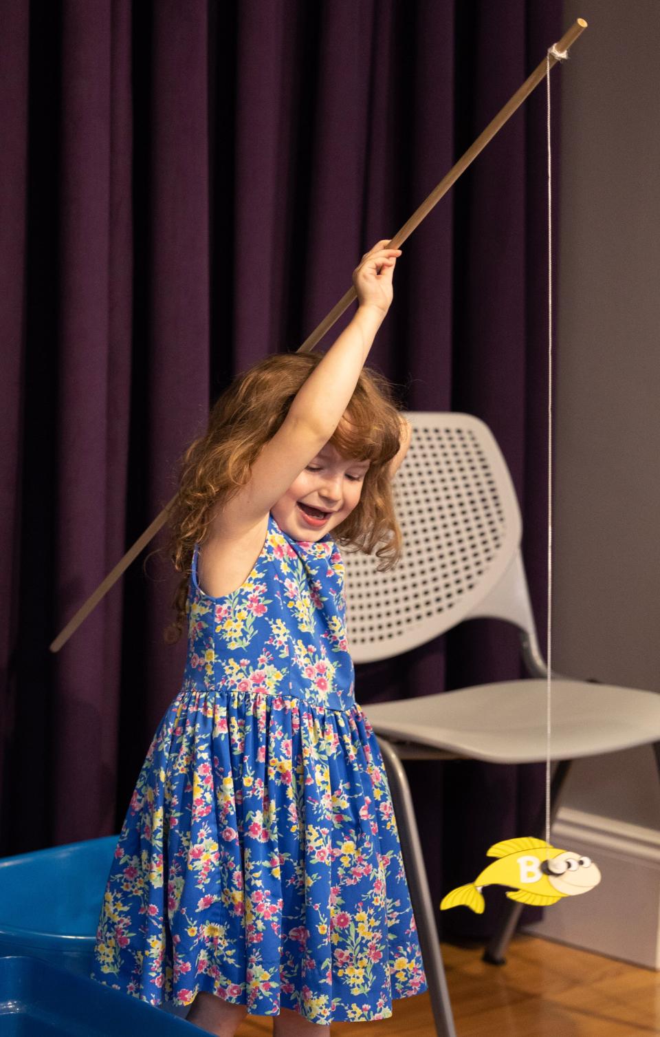 Yazmin Wilhelm, 5, tries her hand at the letter fishing game at the Massillon Public Library's summer reading kickoff. This year's theme is "Oceans of Possibilities." Patrons of all ages can register to particpate in a reading program at libraries across Stark County.