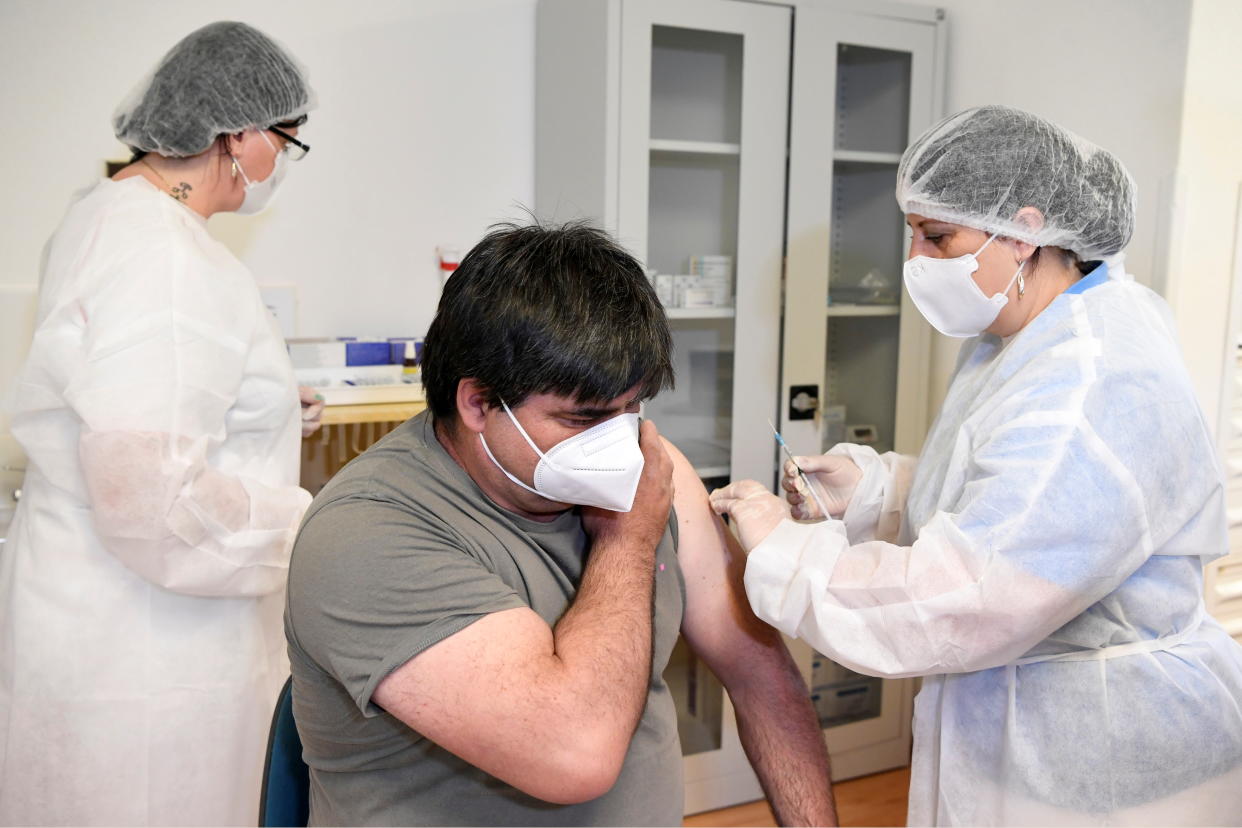 A man receives a dose of the Sputnik V vaccine against the coronavirus disease (COVID-19) at a vaccination centre in Zilina, Slovakia June 7, 2021. REUTERS/Radovan Stoklasa