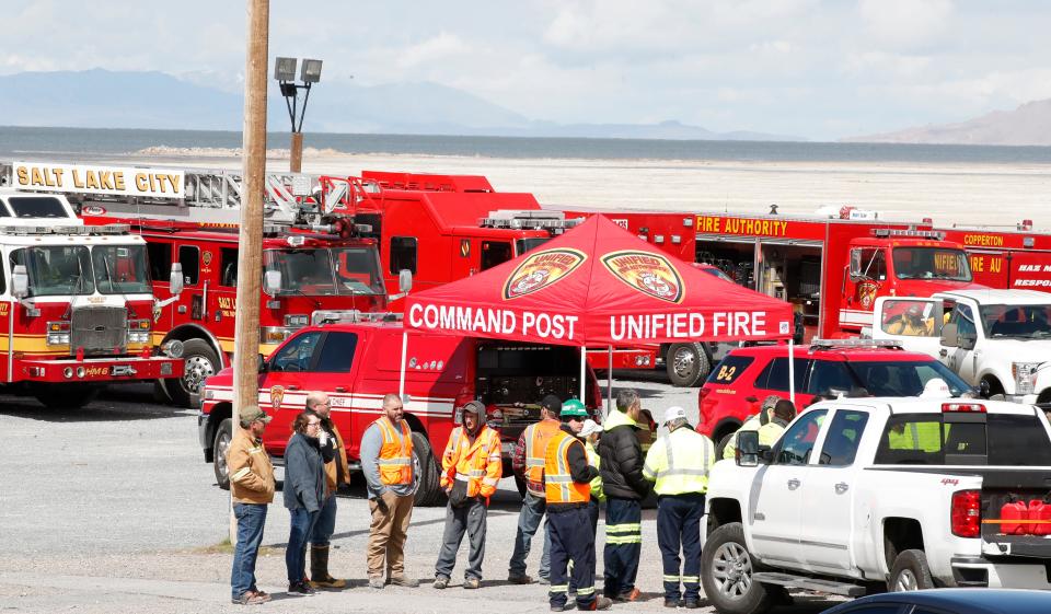 Firefighters and other emergency responders gather at Kennecott mining company in Magna, Utah. where an earthquake on March 18, 2020, sparked a chemical leak.