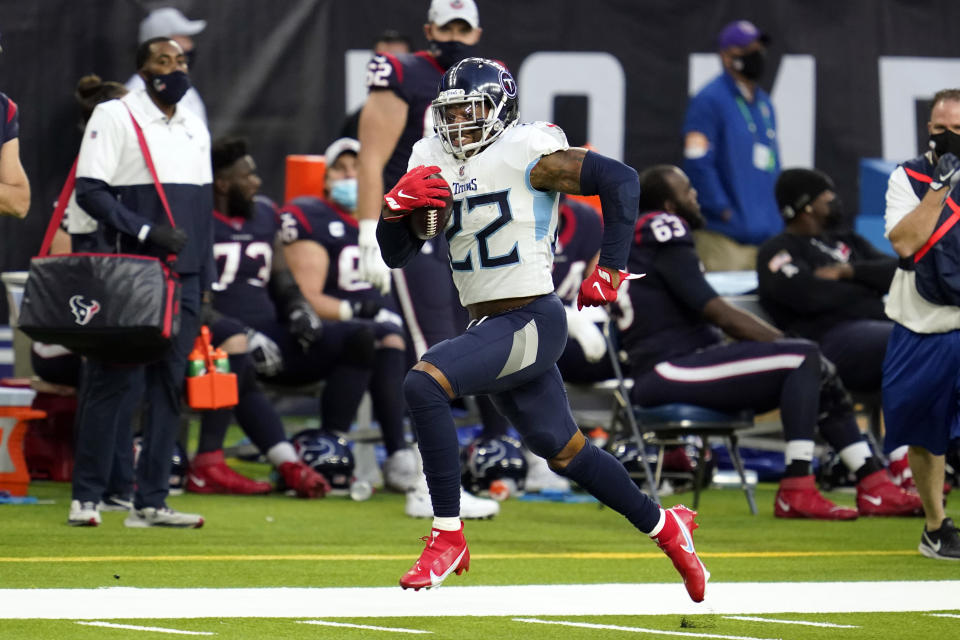 Tennessee Titans running back Derrick Henry (22) runs for a first down against the Houston Texans during the second half of an NFL football game Sunday, Jan. 3, 2021, in Houston. (AP Photo/Sam Craft)