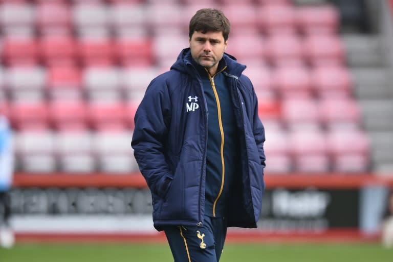 Tottenham Hotspur's Argentinian head coach Mauricio Pochettino checks out the conditions ahead of the English Premier League football match between Bournemouth and Tottenham Hotspur on October 22, 2016