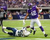 Aug 28, 2016; Minneapolis, MN, USA; Minnesota Vikings running back Jhurell Pressley (42) breaks a tackle from San Diego Chargers linebacker Shaq Petteway (56) during the third quarter in a preseason game at U.S. Bank Stadium. The Vikings won 23-10. Mandatory Credit: Brace Hemmelgarn-USA TODAY Sports