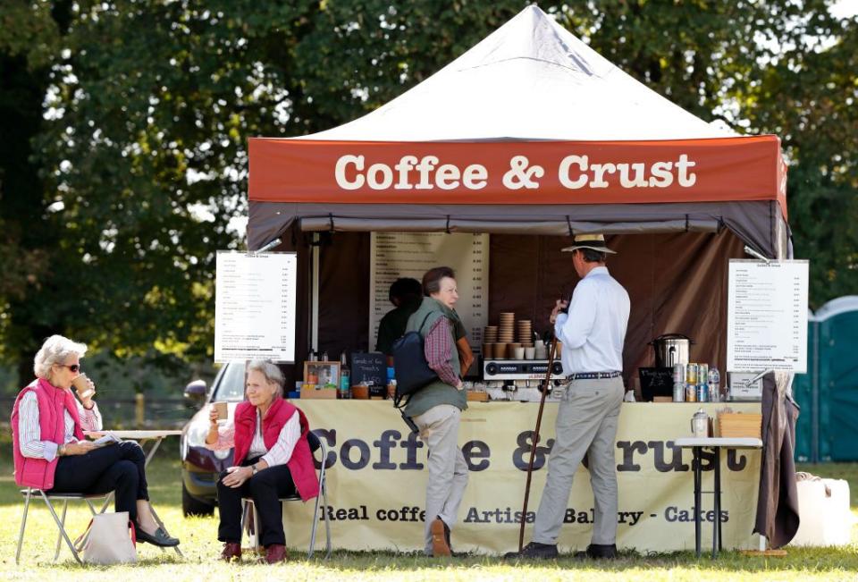 <p>Princess Anne skipped the tea and instead picked up a cup of joe in 2019. She waited at a kiosk for her order to be ready with her husband, Timothy Laurence. </p>