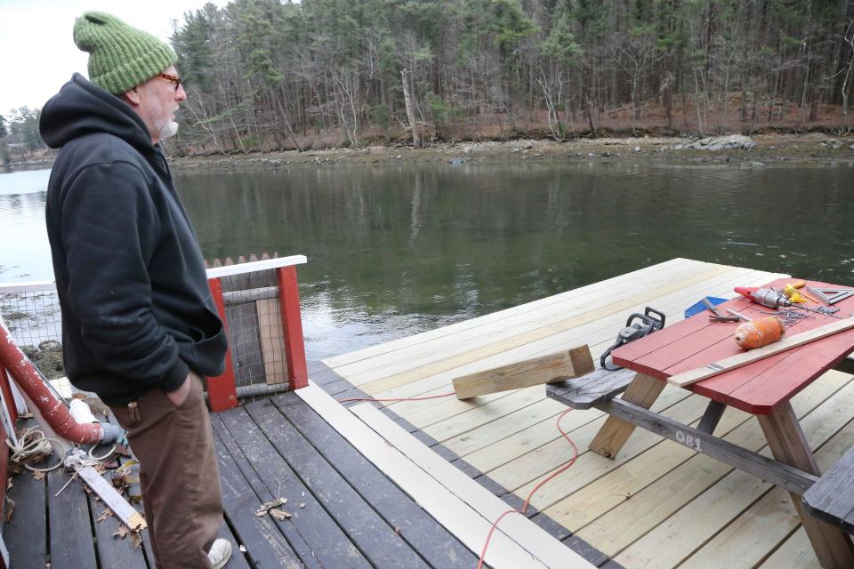 Chauncey Creek Lobster Pier owner Ron Spinney is repairing his business following the January storms. Much of the deck was destroyed and needed to be rebuilt.