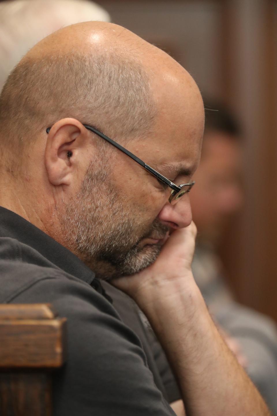 Steve Powell, the father of Sydney Powell, becomes emotional Wednesday as he listens to the testimony of Betsy Brown, Sydney's maternal grandmother. Sydney Powell is on trial for the slaying of Brenda Powell, Steve's wife.