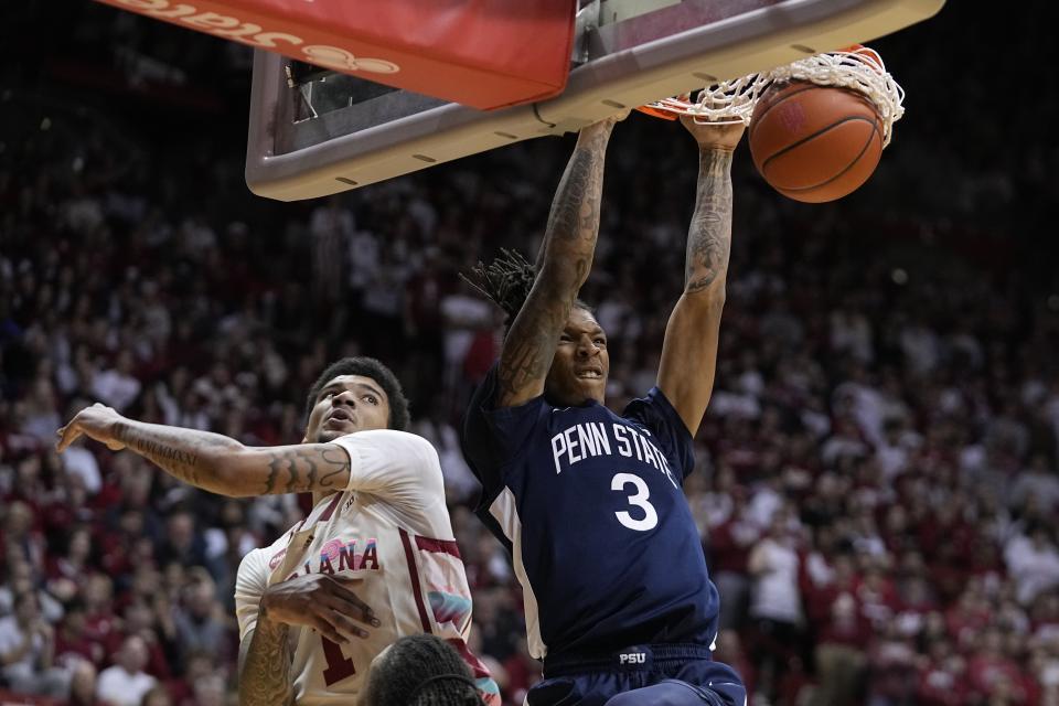 Penn State's Nick Kern Jr. (3) dunks over Indiana's Kel'el Ware (1) during the first half of an NCAA college basketball game, Saturday, Feb. 3, 2024, in Bloomington, Ind. (AP Photo/Darron Cummings)