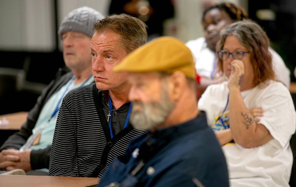 Clients of the Senator Philip D. Lewis Center take part in an event sponsored by the Palm Beach County Homeless Coalition during National Homeless Persons' Remembrance Day December 21, 2023 in West Palm Beach.