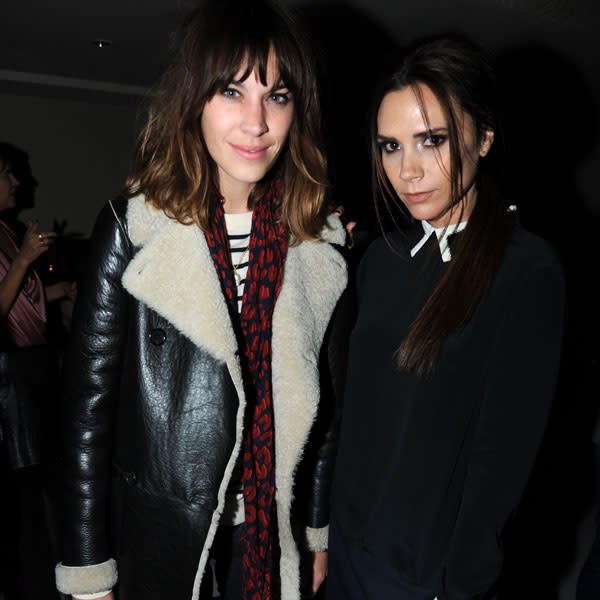 Alexa Chung and Victoria Beckham pose together in London at the after party for her 'Victoria, Victoria Beckham' launch. Victoria looks very uncomfortable here and struggles to raise a smile. Ever conscious of how unkind a camera can be, she raises her chin slightly to avoid the double chin effect. © Rex