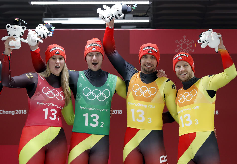 <p>From left, Natalie Geisenberger, Johannes Ludwig, Tobias Wendl and Tobias Arlt of Germany celebrates winning the gold medal in the finish area after the luge team relay at the 2018 Winter Olympics in Pyeongchang, South Korea, Thursday, Feb. 15, 2018. (AP Photo/Andy Wong) </p>
