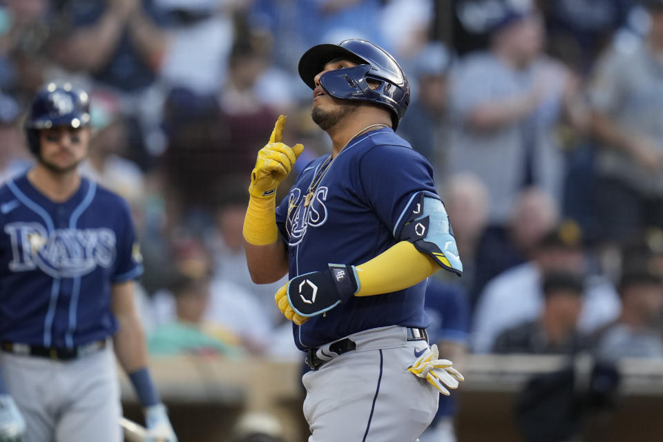 Tampa Bay Rays' Isaac Paredes points skyward after hitting a home run during the second inning of a baseball game against the San Diego Padres, Friday, June 16, 2023, in San Diego. (AP Photo/Gregory Bull)