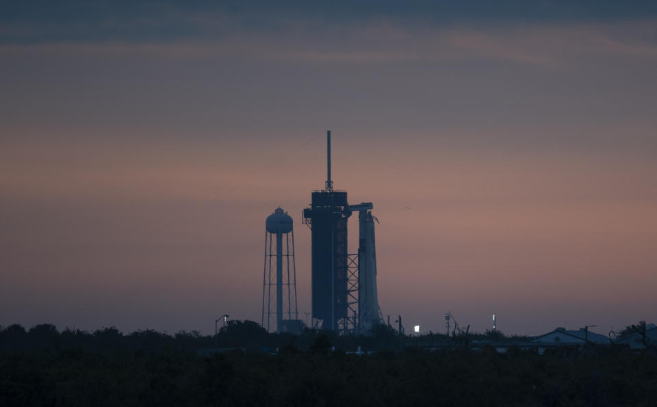 A SpaceX Falcon 9 rocket is seen on the launch pad, Wednesday, May 27, 2020, at Kennedy Space Center in Florida. SpaceX plans to launch two NASA astronauts to the International Space Station. This will be the first astronaut launch from Florida in nearly a decade, and a first for a private company. (Joel Kowsky/NASA via AP)