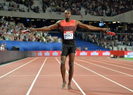 Jul 22, 2016; London, United Kingdom; Usain Bolt (JAM) takes a victory lap after winning the 200m in 19.89 in the London Anniversary Games during an IAAF Diamond League meet at Olympic Stadium. Mandatory Credit: Kirby Lee-USA TODAY Sports