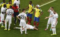 France's Lucas Digne lies on the pitch after being fouled by Ecuador's Antonio Valencia during their 2014 World Cup Group E soccer match at the Maracana stadium in Rio de Janeiro June 25, 2014. Valencia was shown the red card for the action. REUTERS/Francois Xavier Marit/Pool (BRAZIL - Tags: SOCCER SPORT WORLD CUP)