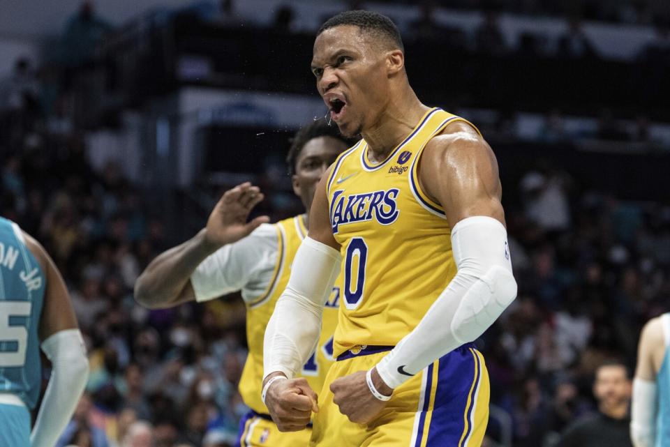 The Lakers' Russell Westbrook (0) celebrates with teammate Stanley Johnson during the second half Jan. 28, 2022.