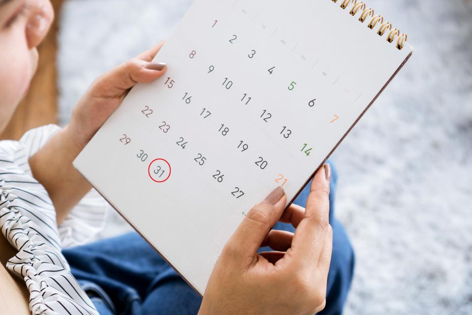 Person looking at a calendar