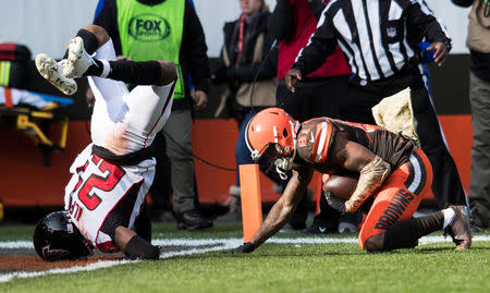 Nov 11, 2018; Cleveland, OH, USA; Atlanta Falcons cornerback Robert Alford (23) lands on his head after a defending a touchdown catch by Cleveland Browns wide receiver Rashard Higgins (81) during the first quarter at FirstEnergy Stadium. Mandatory Credit: Ken Blaze-USA TODAY Sports