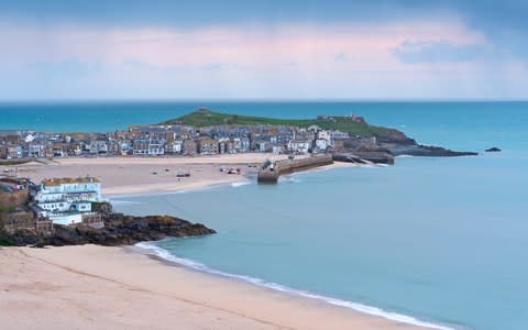 Porthminster Beach and St. Ives at dawn - Credit: Getty Images