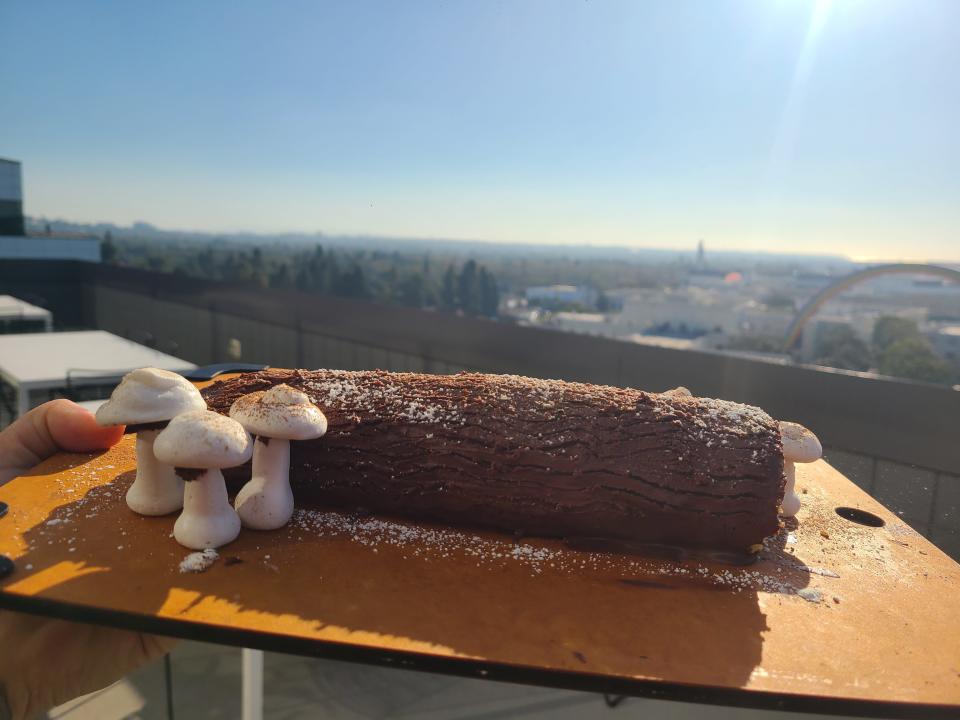 A cake is displayed in front of the Culver City skyline.