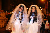 <p>Two zombie brides pose for a photo at the 44th annual Village Halloween Parade in New York City on Oct. 31, 2017. (Photo: Gordon Donovan/Yahoo News) </p>