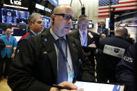 Trader Jeffrey Vazquez works on the floor of the New York Stock Exchange, Wednesday, June 19, 2019. Investors are in wait-and-see mode hours ahead of a widely anticipated Federal Reserve decision on interest rates. (AP Photo/Richard Drew)