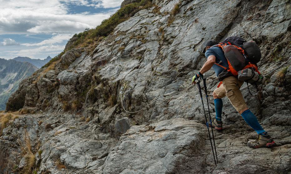 <span>A walker on one of the few cabled sections of the GR54 route in the Écrins national park. <em>All photographs by David Lintern</em></span><span>Photograph: David Lintern/The Guardian</span>