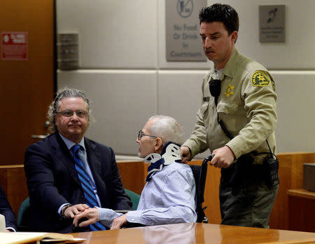 Robert Durst in a wheelchair arrives for his arraignment on capital murder charges in the death of Susan Berman, with one of his lawyers David Z. Chesnoff (L) touching his hand, in Los Angeles, California, U.S. November 7, 2016. REUTERS/Kevork Djansezian