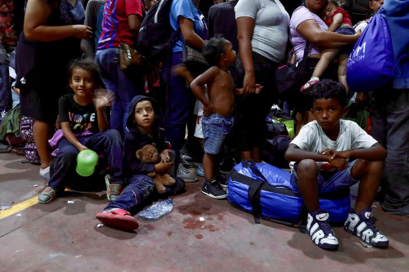 FILE PHOTO: Migrants are being transferred to Huixtla to continue their procedure to obtain a transit permit, in Mapastepec