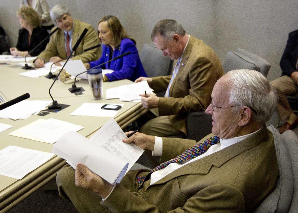 Sen. Gerald Dial, R-Lineville, right, studies the proposed education budget during a meeting of the Senate Finance and Taxation-Education Committee at the Alabama Statehouse in Montgomery, Ala., Wednesday, April 18, 2012. Others pictured are: Committee Chairman Sen. Trip Pittman, R-Daphne, second from left, Sen. Vivian Figures, D-Mobile, and Sen. Arthur Orr, R-Decatur. (AP Photo/Dave Martin)