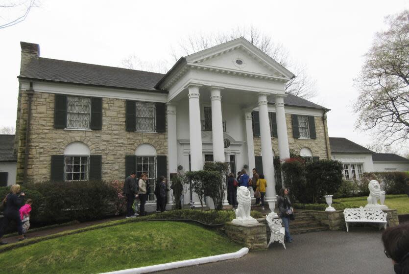 FILE - In this March 13, 2017, file photo, visitors get ready to tour Graceland in Memphis, Tenn.