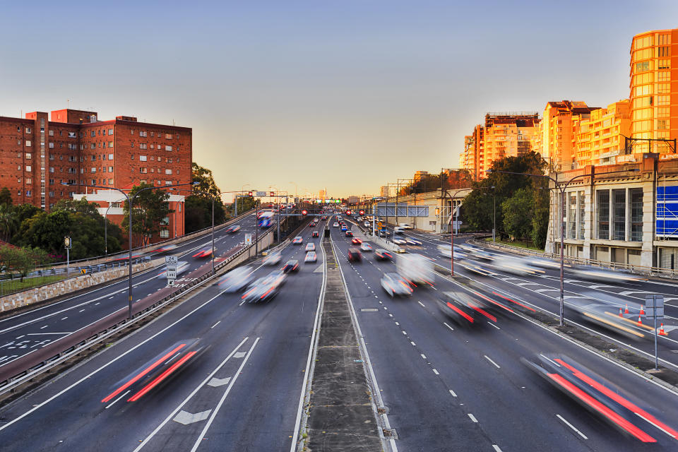 Blurred moving cars on freeway. Source: Getty Images