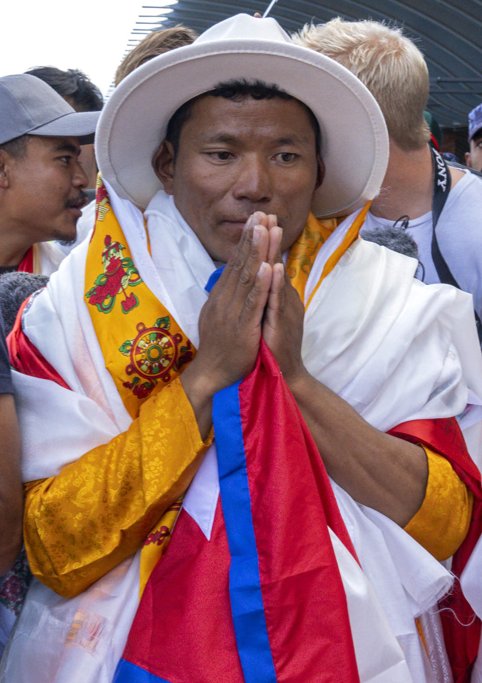 Nepali sherpa guide Tenjen Sherpa, 35, who with Norwegian climber Kristin Harila climbed the world's 14 tallest mountains in record time, arrives in Kathmandu, Nepal, Saturday, Aug. 5, 2023. Harila and Sherpa shattered the record for the fastest climb of the 14 mountains more than 8,000 meters (about 26,000 feet) high when they topped Mount K2 in Pakistan late last month. The previous record was 189 days, and the pair did it in 92 days. (AP Photo/Niranjan Shrestha)