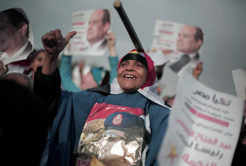 Egyptian supporters of presidential candidate, Abdel-Fattah el-Sissi, chant slogans during a campaign event in Cairo, Egypt, Saturday, May 10, 2014. In the first rally to back el-Sissi’s bid for presidency since the campaigning began last week, supporters of the former military chief organized an evening event in the gardens of a Cairo conference center, drawing several thousands -- a much smaller crowd than originally announced. (AP Photo/Khalil Hamra)