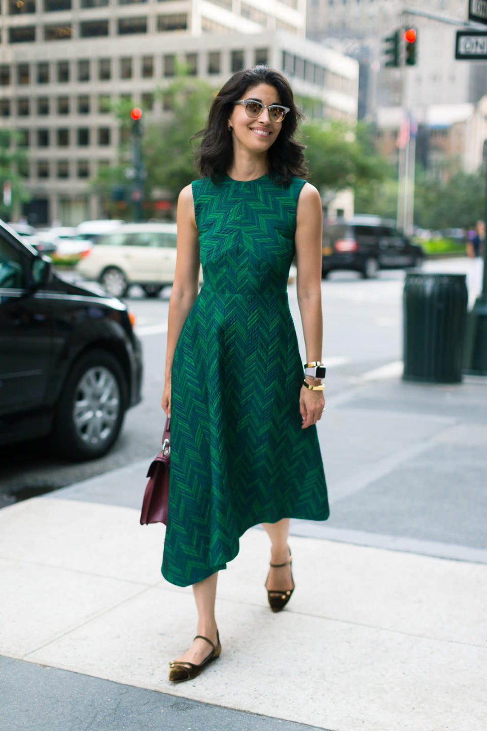 A mulberry leather bag sets off an emerald green dress just so at New York Fashion Week.