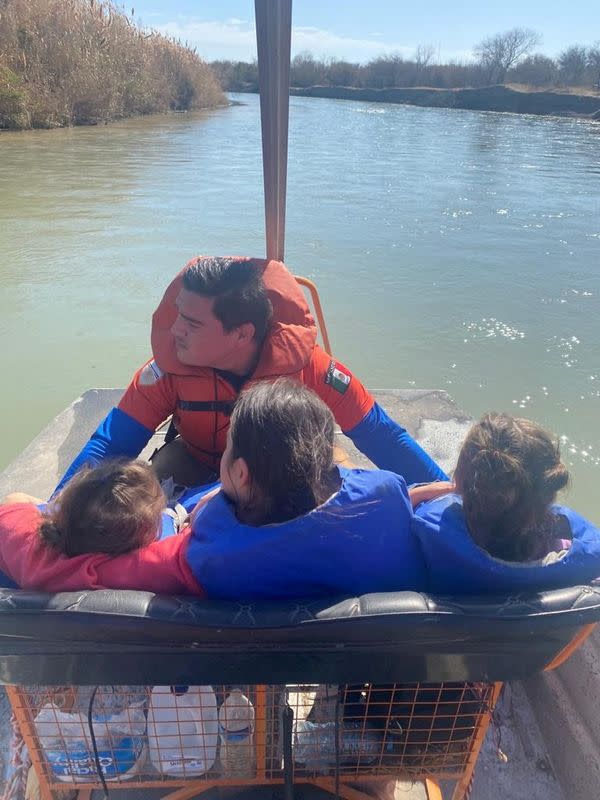 Agents of the Mexican immigrant welfare agency Grupo Beta rescue Salvadoran minors found on an islet on the Rio Bravo, in Piedras Negras