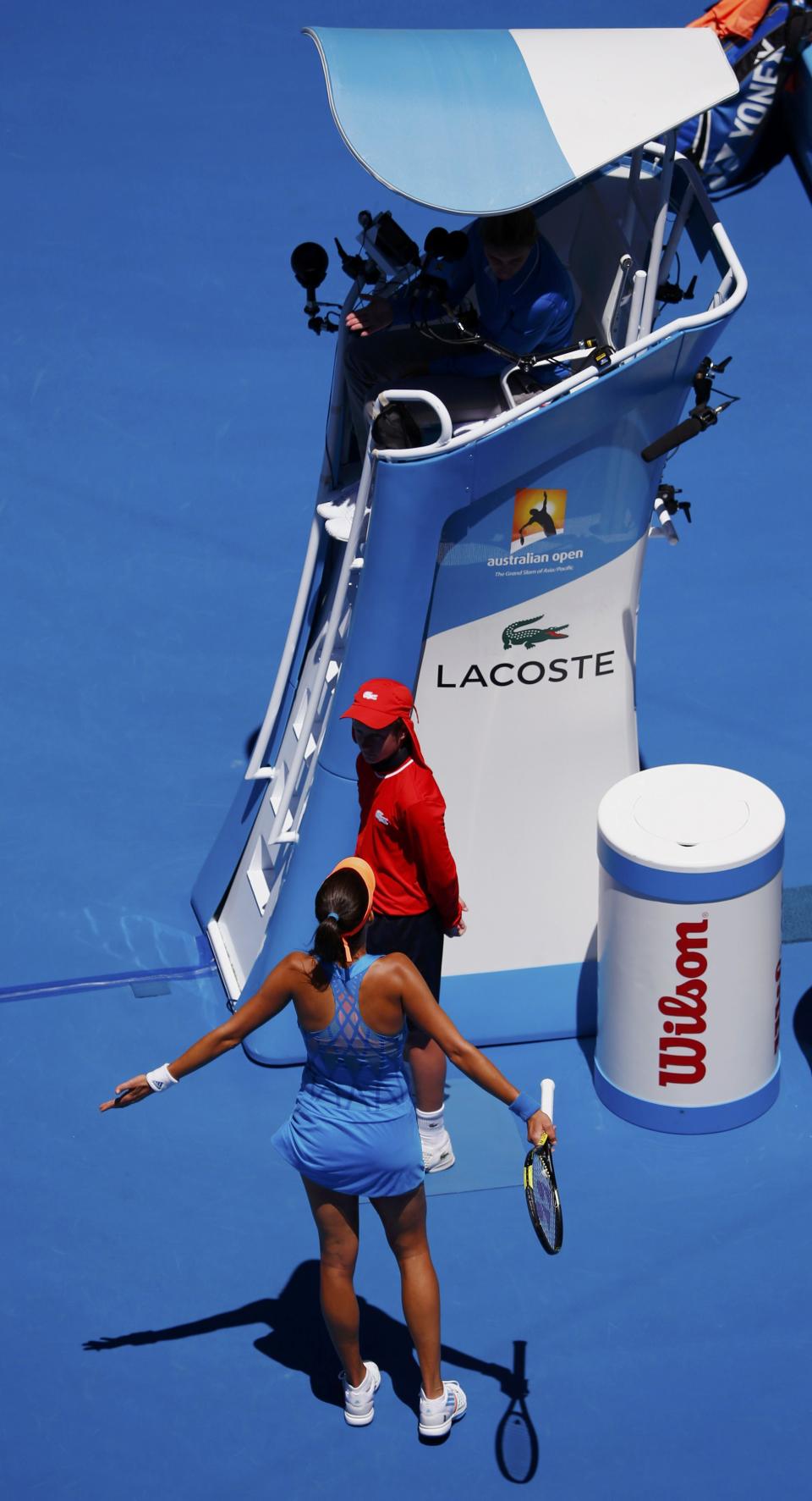 Ana Ivanovic of Serbia argues a call with chair umpire Mariana Alves (top) of Portugal during her women's singles quarter-final match against Eugenie Bouchard of Canada at the Australian Open 2014 tennis tournament in Melbourne January 21, 2014. REUTERS/David Gray (AUSTRALIA - Tags: SPORT TENNIS)