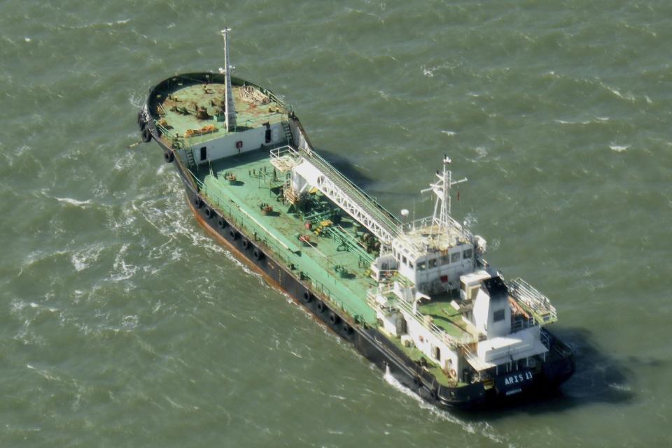 FILE - In this Monday, Oct. 27, 2014 file photo, the Aris 13 oil tanker is seen from a helicopter in the harbor of Gladstone, Australia. A Somalia official said Thursday, March 16, 2017 that pirates who seized the Comoros-flagged oil tanker have released the ship without conditions after negotiations by local elders and officials, and it is now heading to Bossaso port, the region's commercial hub. (Kevin Finnigan/Tropic Maritime Images via AP, File)