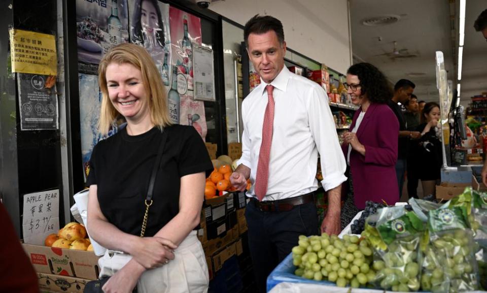 NSW Labor leader Chris Minns with wife Anna (left) and Ryde candidate Lyndal Howison on the campaign trail in Eastwood on Friday