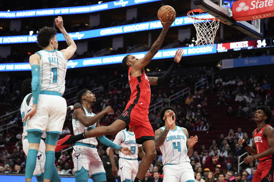 Houston Rockets forward Jabari Smith Jr. drives to the basket during the first half of the team's NBA basketball game against the Charlotte Hornets, Wednesday, Nov. 1, 2023, in Houston. (AP Photo/Eric Christian Smith)