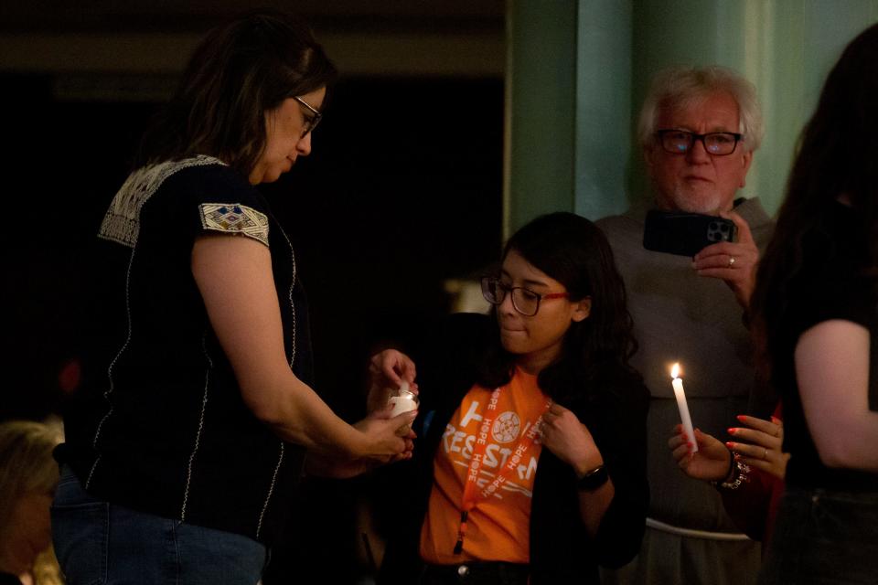 Candles are lit on Thursday, March 21, 2024, at Sacred Heart Church in Downtown El Paso for a vigil for human dignity for the 40 migrants that were killed in a fire at Ciudad Juarez on March 28, 2023.
