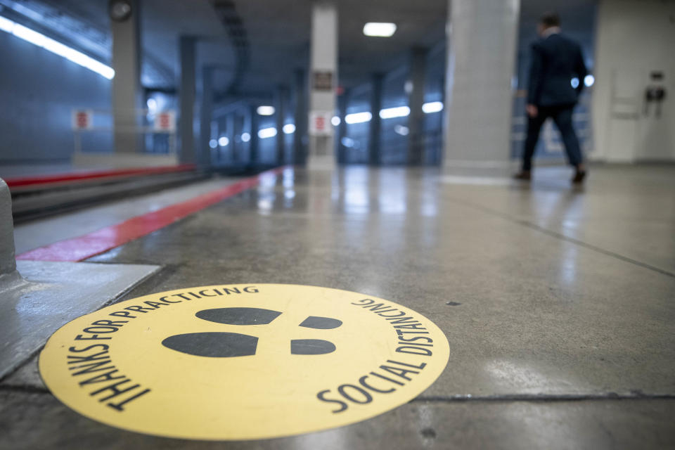 WASHINGTON, DC - OCTOBER 16: Stickers encouraging social distancing in response to the coronavirus pandemic are seen in the Senate subway of the U.S. Capitol on October 16, 2020 on Capitol Hill in Washington, DC. With less than three weeks before the November presidential elections, the Trump administration and House Speaker Nancy Pelosi are continuing their ongoing negotiations for a stimulus deal. (Photo by Sarah Silbiger/Getty Images)