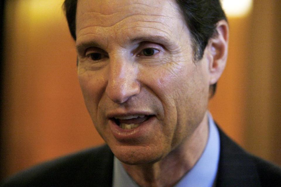 FILE - This Oct. 14, 2009 file photo shows Senate Finance Committee Chairman Sen. Ron Wyden, D-Ore. speaking on Capitol Hill in Washington. Congress is poised to give doctors who treat Medicare patients an 11th hour reprieve from a cut in their government fees. Monday’s Senate vote would send legislation to repair Medicare’s flawed payment formula for a year to President Barack Obama for his signature. It comes just hours before a midnight deadline Wyden promises to keep pressing ahead with a long-term solution, proposing to use savings from the troop drawdown in Afghanistan to pay the cost. Republicans and most budget experts say such savings are phony and are demanding at least some of the money to come from cuts to Obama’s Affordable Care Act. (AP Photo/Charles Dharapak, File)