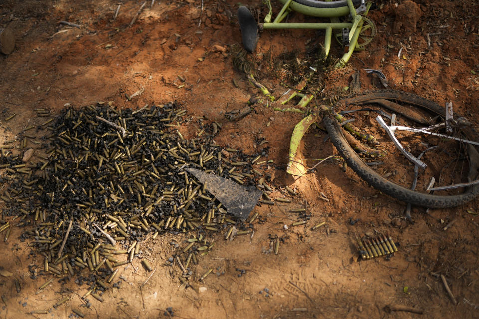 Ammunition bullets are seen next to bicycle at Kibbutz Kissufim in southern Israel, Saturday, Oct. 21, 2023. The Kibbutz was overrun by Hamas militants from the nearby Gaza Strip on Oct. 7, when they killed and captured many Israelis. (AP Photo/Francisco Seco)