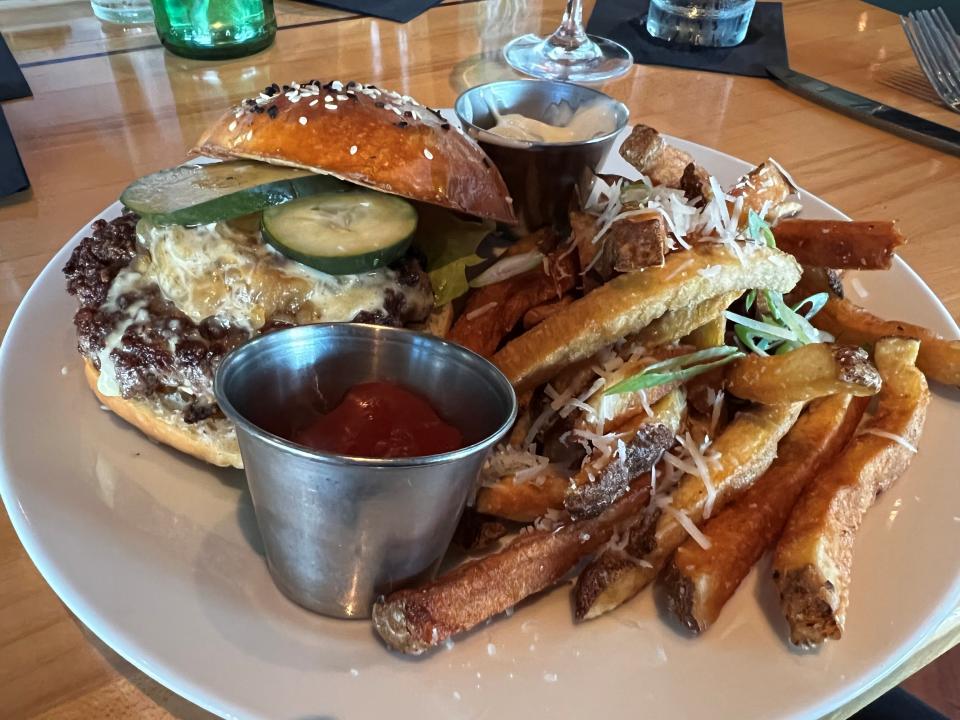 The house burger at Alba features Prairie Breeze fondue, truffle aioli, caramelized onions and greens from Lee's Greens.