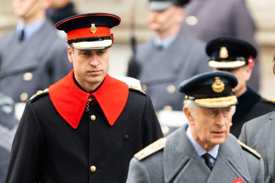 <p>Samir Hussein/WireImage</p> Prince William and King Charles at the National Service of Remembrance at The Cenotaph on November 12, 2023 in London.